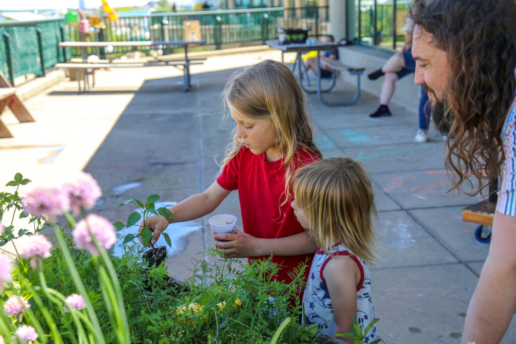 Two young children gardening